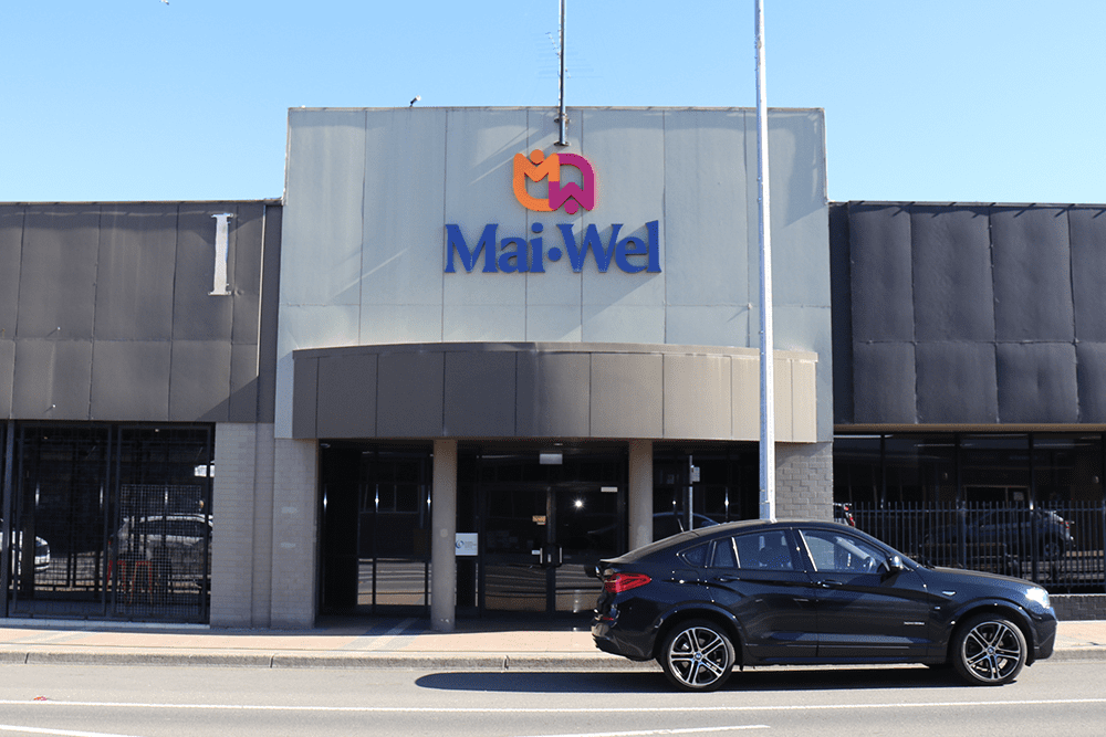 The front of the Mai-Wel on Vincent office building with the Mai-Wel logo displayed above the door