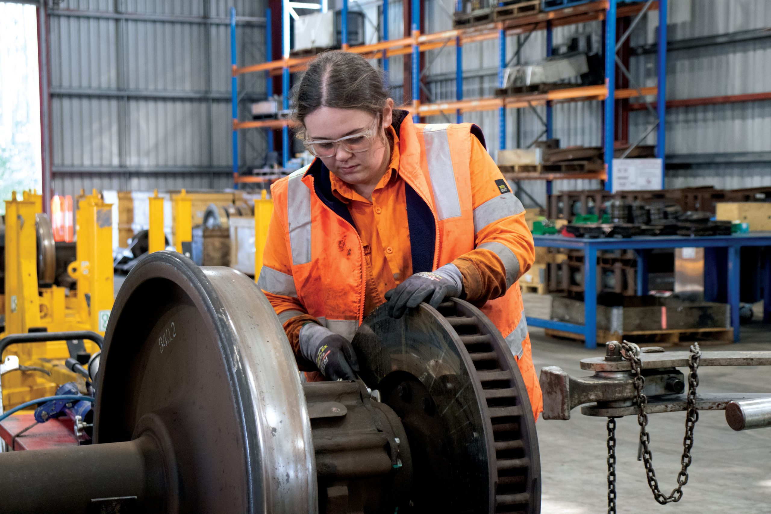 Woman working on heavy industry material