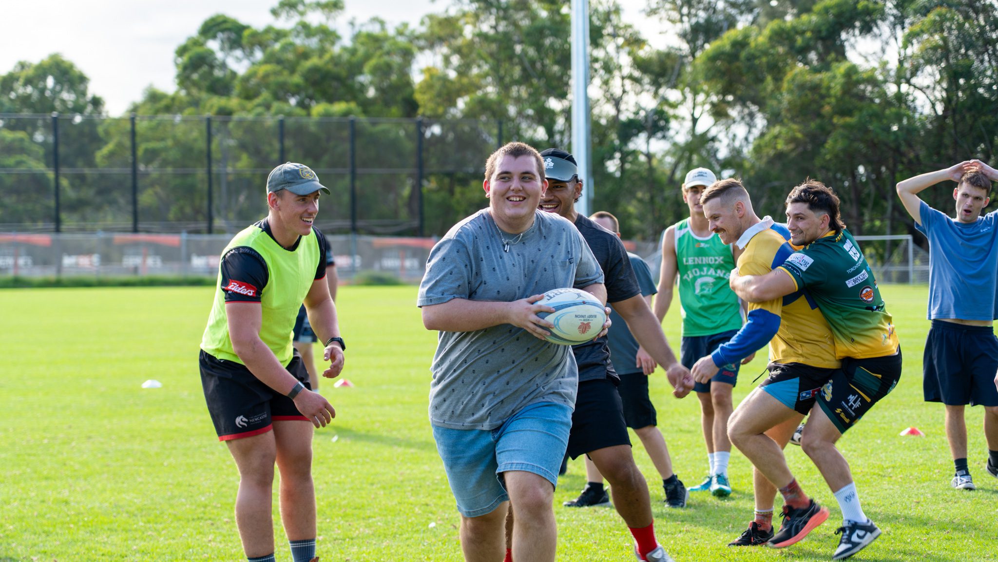 Man running with rugby ball