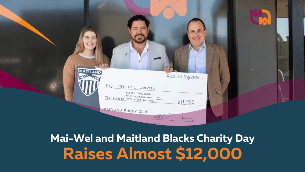 Representatives from Maitland Rugby Club present a cheque for $11,958 to Mai-Wel Limited, photographed outside the Mai-Wel offices