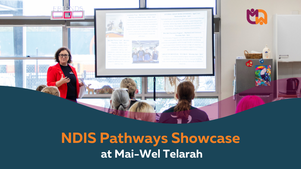 Mai-Wel Chief Participant Officer Jenny Cappellacci presents to a room of seated attendees at the NDIS Pathways Showcase at Mai-Wel Telarah, with a projected presentation visible on the screen behind her. Text overlay reads "NDIS Pathways Showcase at Mai-Wel Telarah."