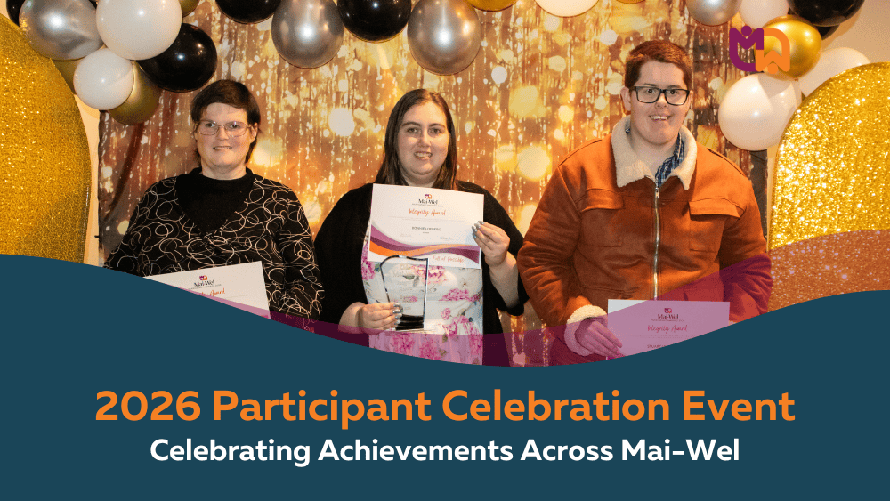 Three Mai-Wel participants smile while holding their award certificates and gifts at the 2026 Participant Celebration Event, standing in front of a gold and black balloon backdrop at Telarah Bowling Club. Text overlay reads "2026 Participant Celebration Event: Celebrating Achievements Across Mai-Wel."